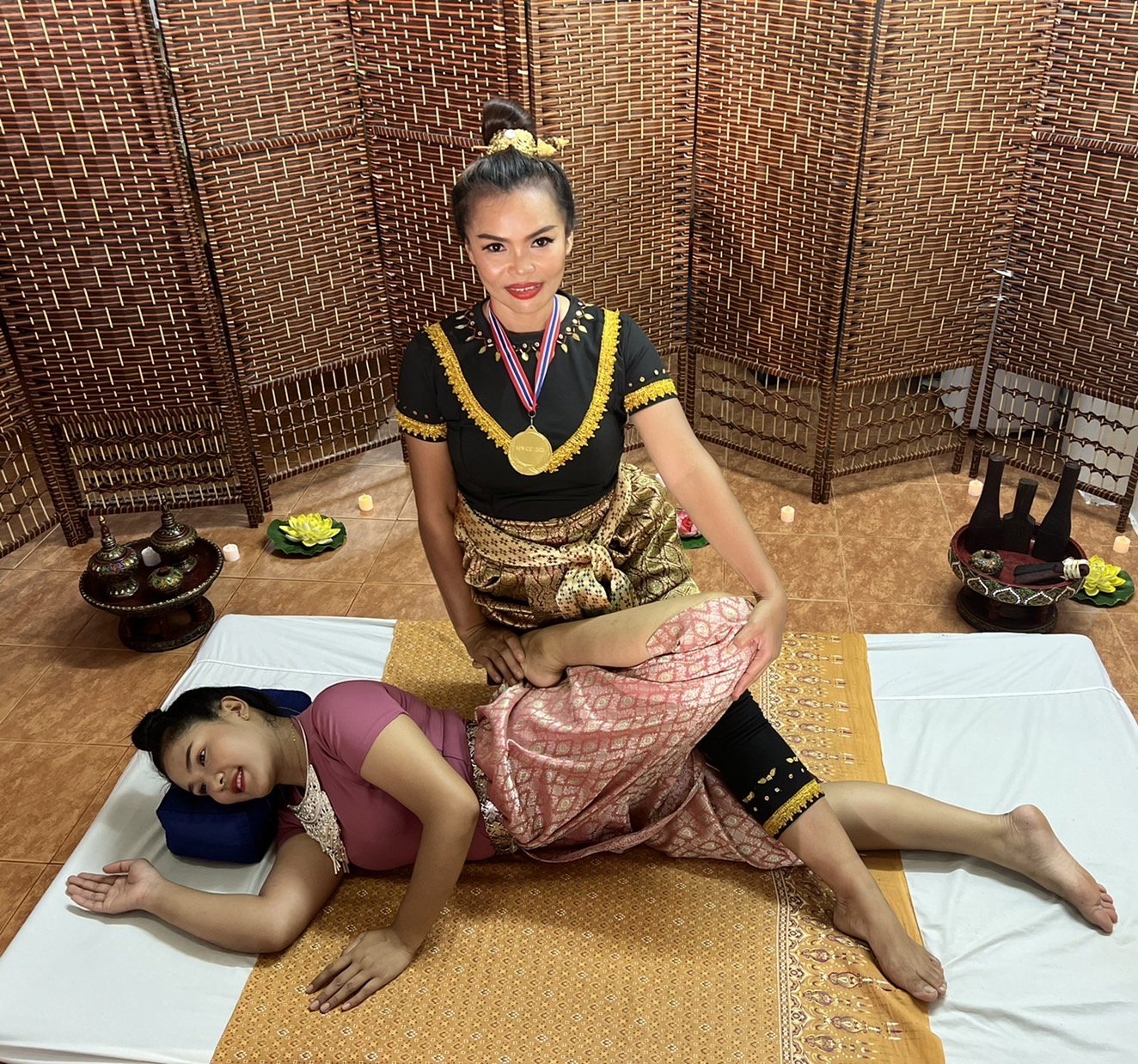 Namfon providing a deep tissue massage and stretch