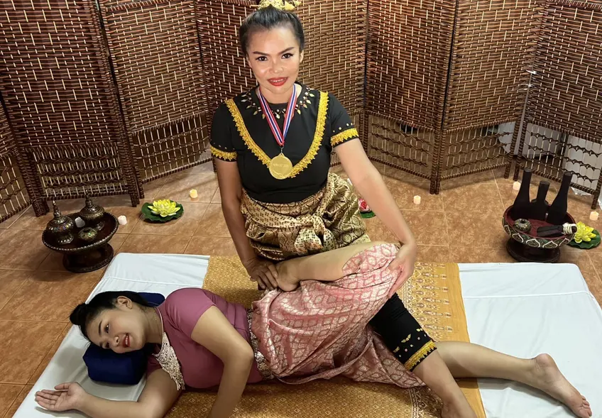 Namfon providing a deep tissue massage and stretch