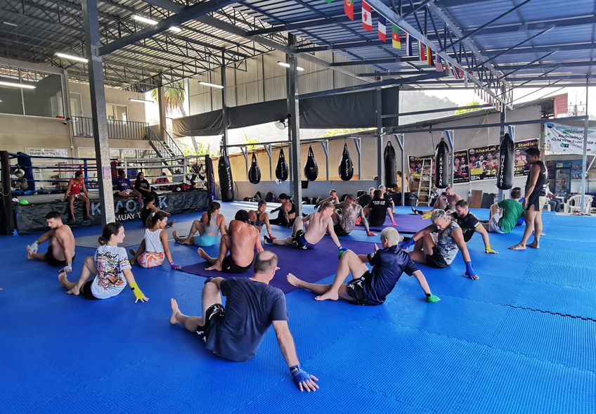 Photo of large group doing pre-training warm-up and stretch